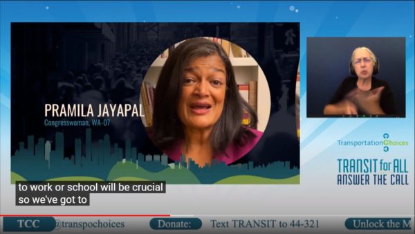 Screenshot of transit for all fundraiser with captioning. Pramila Jayapal speaks with ASL interpreter in smaller image box and "Transit for all" text in bottom right corner.