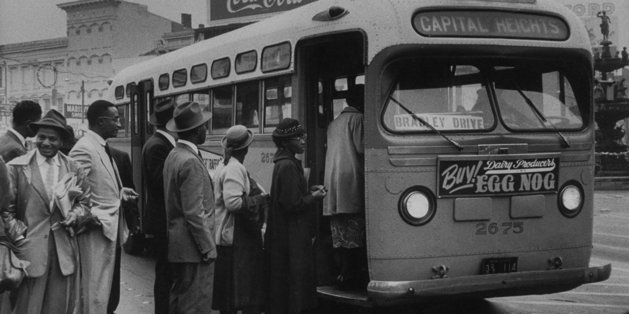 Several Black riders wait to board a bus to Capitol Heights