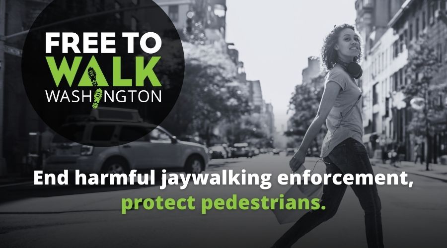 Photo of a Black woman crossing the street with Free to Walk Washington logo overlaid. Text: End harmful jaywalking enforcement, protect pedestrians.