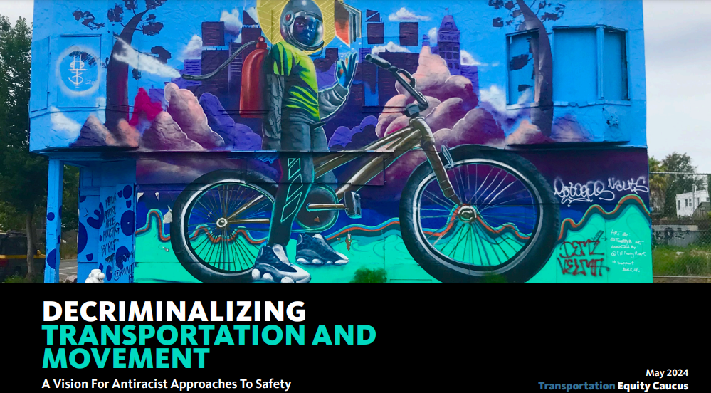 Mural of a dark-skinned youth standing over a bicycle in front of a cityscape wreathed in clouds