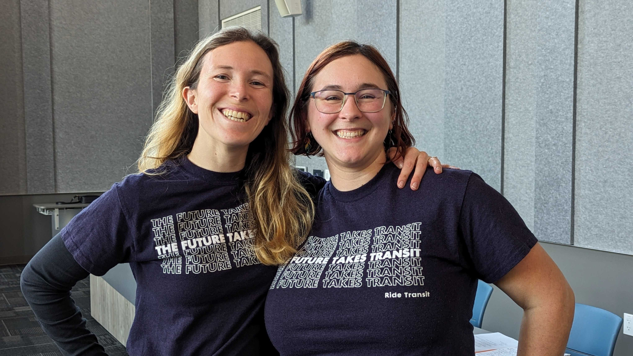McKenna and Laura DOTG McKenna Lux poses in a matching t-shirt with Laura Svancarek, Interim Executive Director of Downtown on the Go.