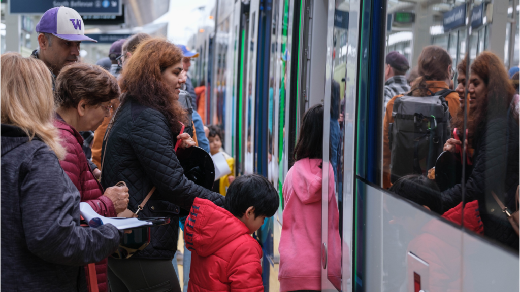 A woman and children board the light rail in South Bellevue. 