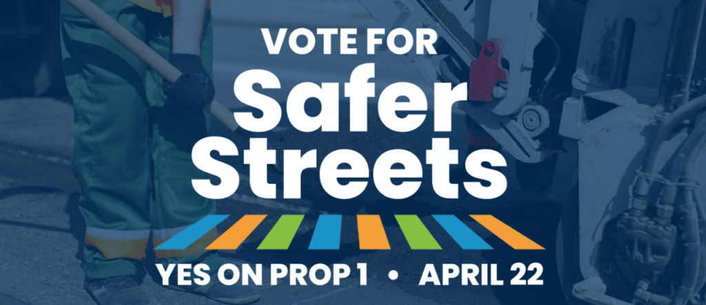Background image of people doing road work with text: "Vote for Safer Streets, Yes on Prop 1, April 22"