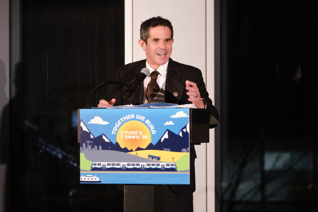 Ryan Mello delivers an address at a podium