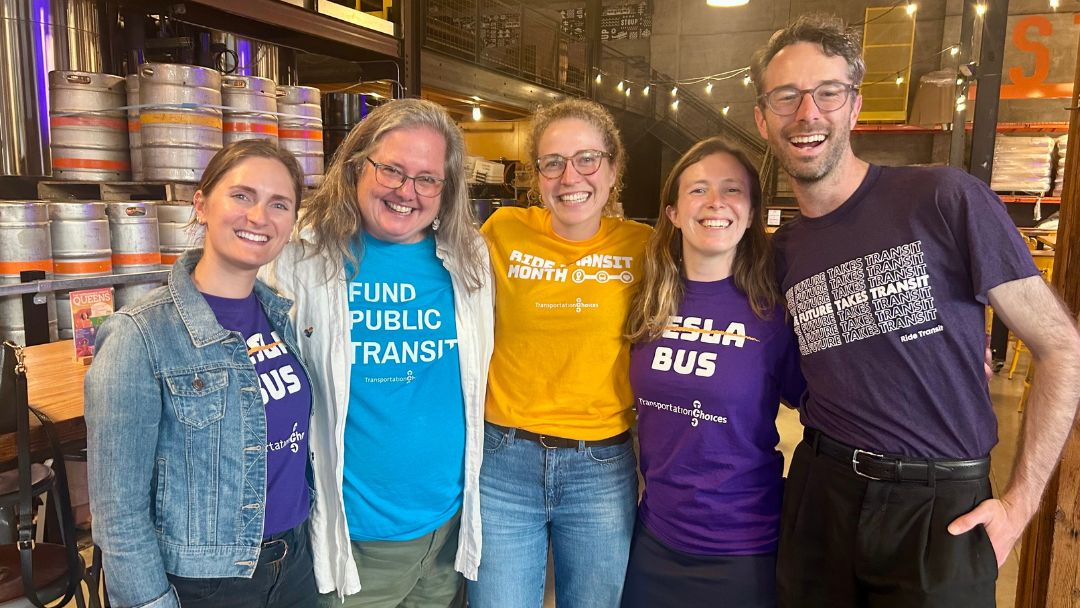 TCC staff in transit t-shirts at a Mariners game.