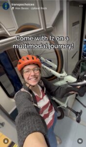 A woman in a bicycle helmet stands next to her bike on a Link light rail train. Text: "Come with Iz on a multimodal journey!"