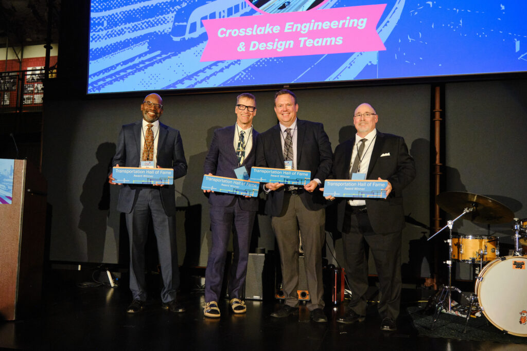 Ron Lewis, John Sleavin, Chad Brown, and Tony Raben accept their Transportation Choices Hall of Fame award on behalf of the Crosslake Connection Engineering and Design Teams.